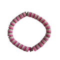 Bracelet with flat disc beads in repeating bright pink, white, and brown stripes.